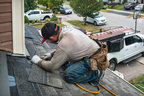 Professional Roofing technician working in East Quogue, NY